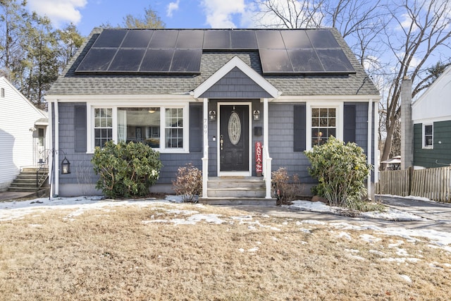 view of front of home featuring solar panels