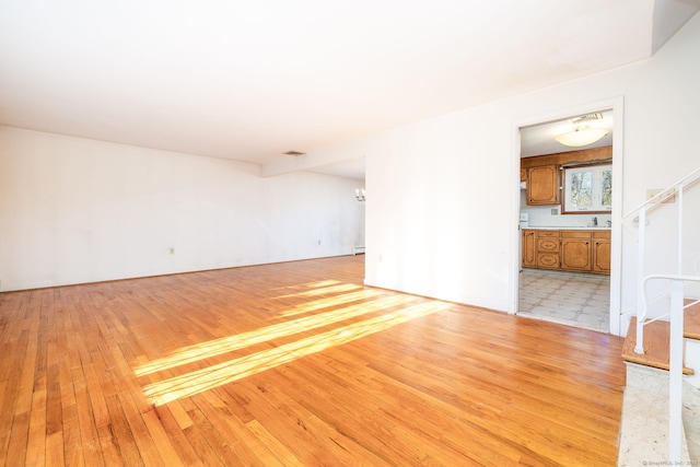 spare room with light hardwood / wood-style floors