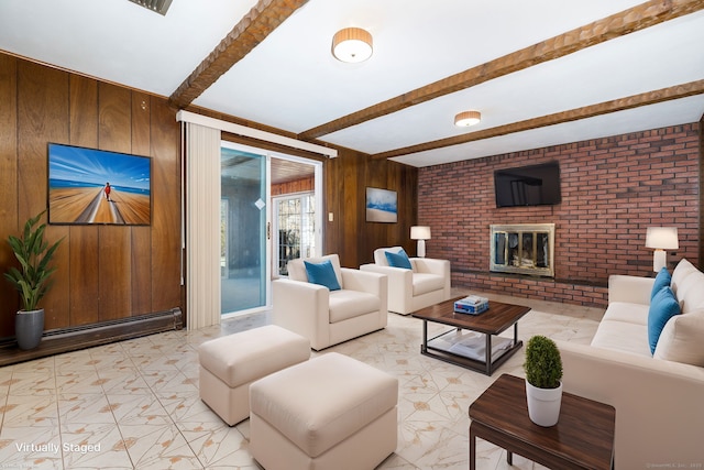 living room featuring brick wall, a fireplace, wooden walls, beamed ceiling, and a baseboard heating unit