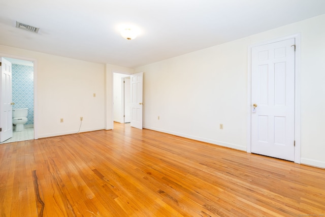 spare room with light hardwood / wood-style floors