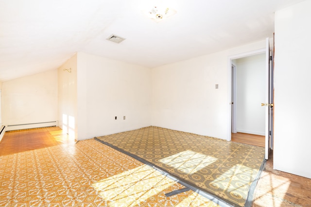 unfurnished room with lofted ceiling