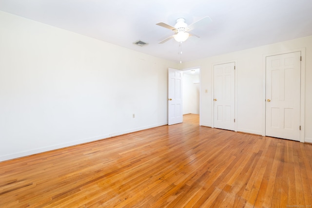 unfurnished bedroom featuring ceiling fan and light hardwood / wood-style flooring