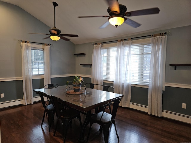 dining space with lofted ceiling, dark hardwood / wood-style flooring, a baseboard heating unit, and a wealth of natural light