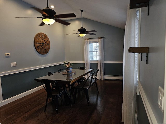 dining space featuring a baseboard radiator, lofted ceiling, and dark wood-type flooring