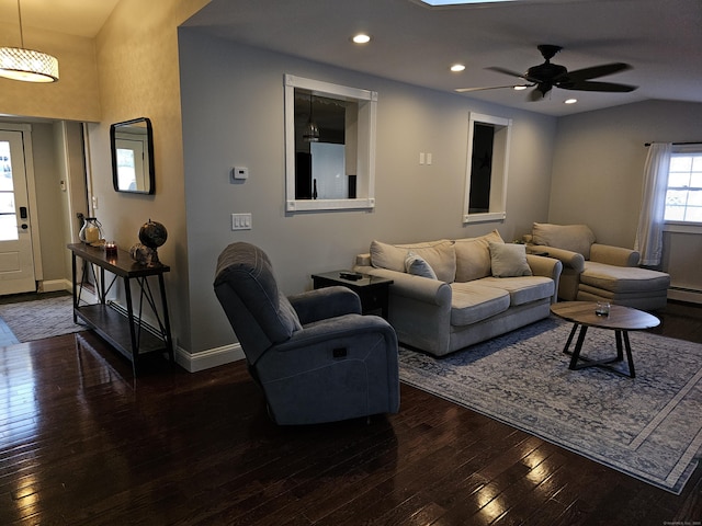 living room with dark hardwood / wood-style flooring and ceiling fan