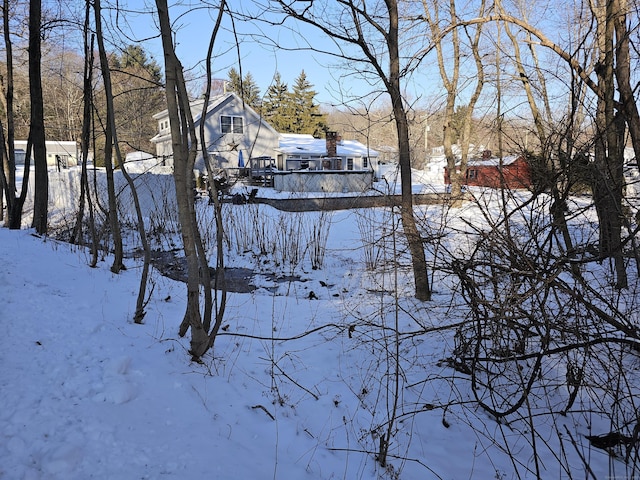 view of yard covered in snow