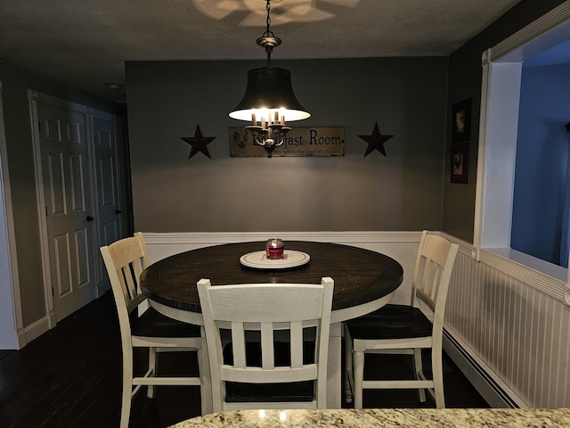 dining area featuring dark hardwood / wood-style floors
