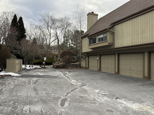 view of side of property with a garage