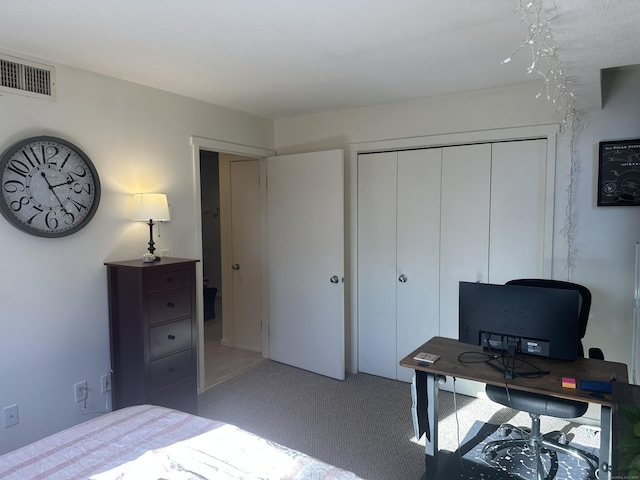 bedroom featuring light carpet and a closet