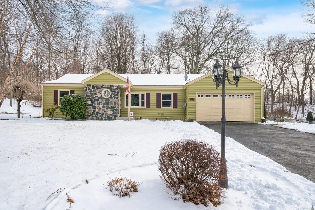 ranch-style home with a garage