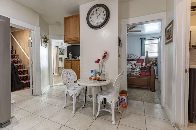 dining room with light tile patterned flooring and ceiling fan