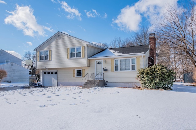 split level home featuring a garage