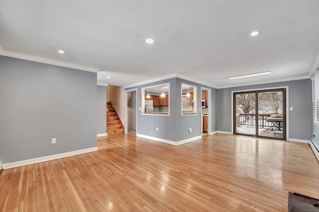 unfurnished living room featuring crown molding and light hardwood / wood-style floors