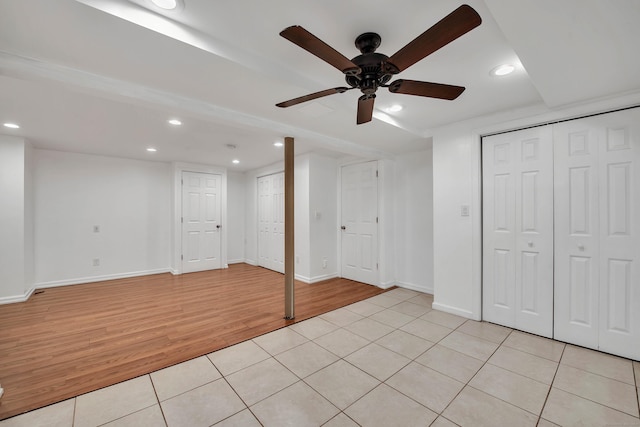 basement featuring light tile patterned floors