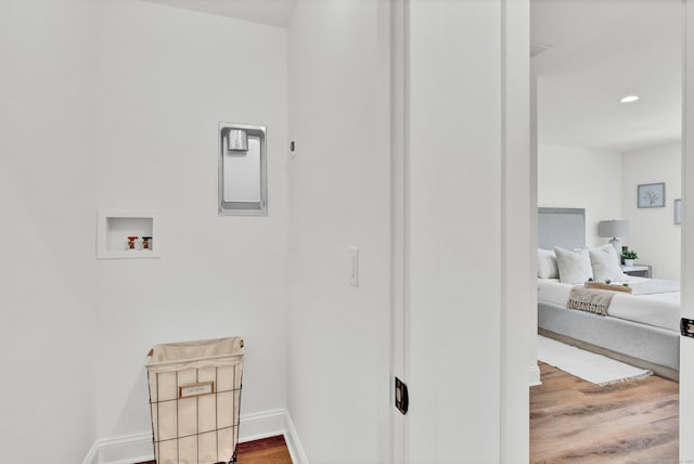 clothes washing area featuring hookup for a washing machine and hardwood / wood-style floors