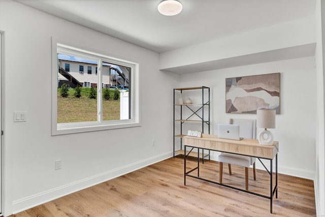 home office featuring hardwood / wood-style floors