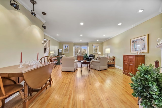 dining area featuring light hardwood / wood-style flooring and ornamental molding