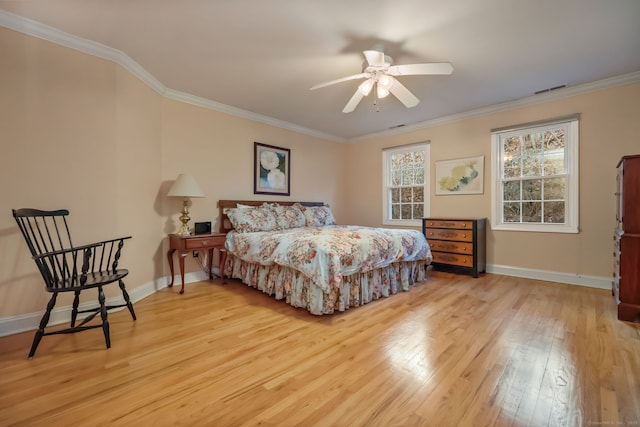 bedroom featuring ornamental molding, ceiling fan, and light hardwood / wood-style flooring