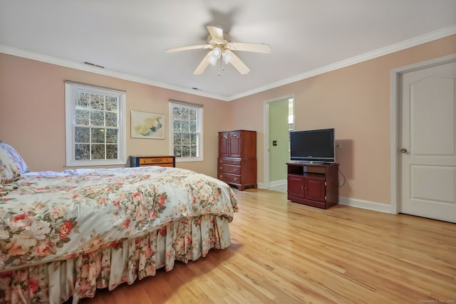 bedroom with crown molding, ceiling fan, and light wood-type flooring