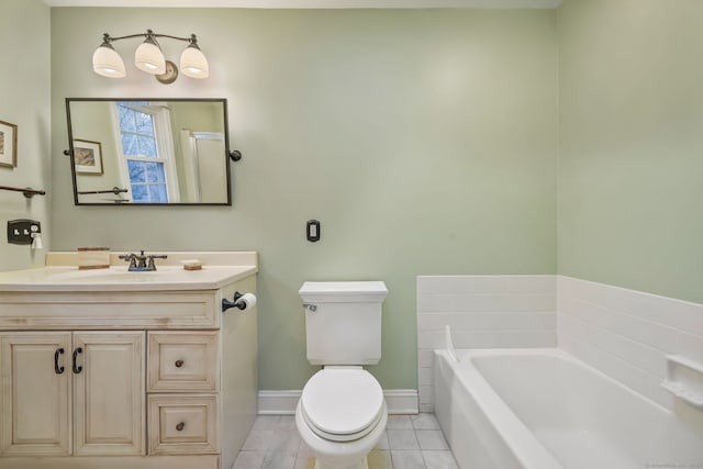 bathroom featuring tile patterned flooring, a bathing tub, vanity, and toilet