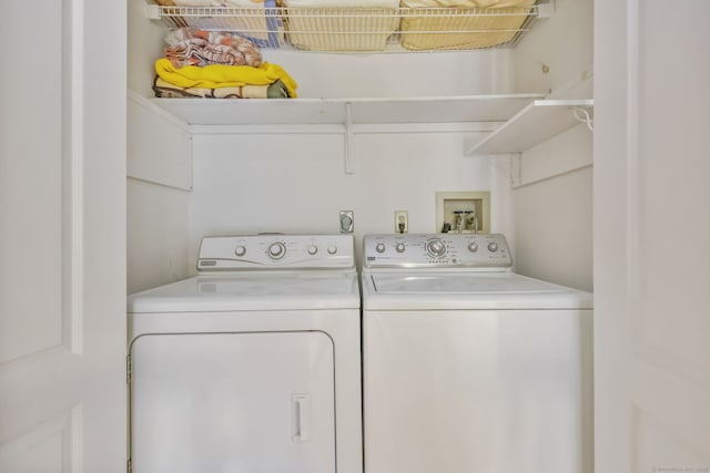 laundry area featuring washing machine and clothes dryer