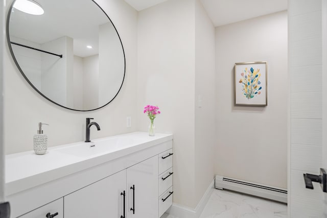 bathroom with vanity and baseboard heating