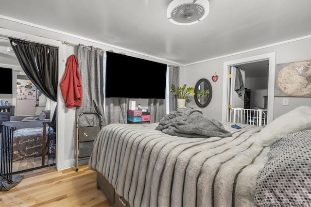 bedroom with wood-type flooring