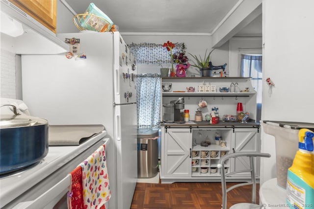 kitchen featuring dark parquet flooring and white fridge