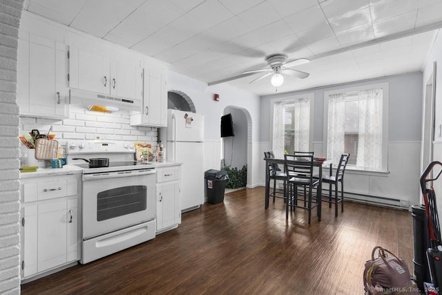 kitchen with dark wood-type flooring, white appliances, a baseboard heating unit, and white cabinets