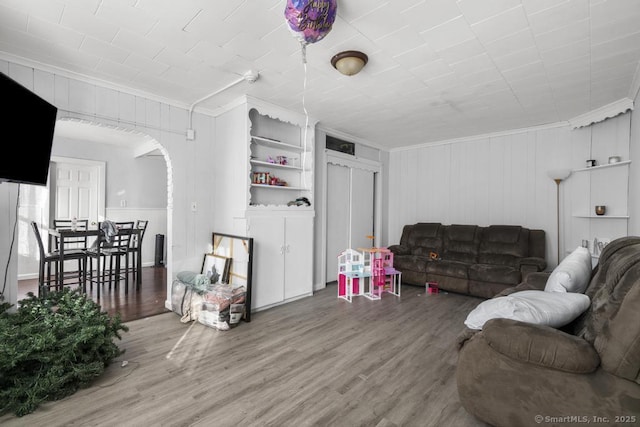 living room featuring ornamental molding and hardwood / wood-style floors