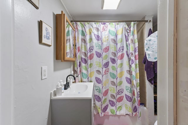 bathroom featuring shower / tub combo with curtain and vanity