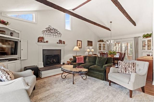 living room with beam ceiling, high vaulted ceiling, a chandelier, and light wood-type flooring