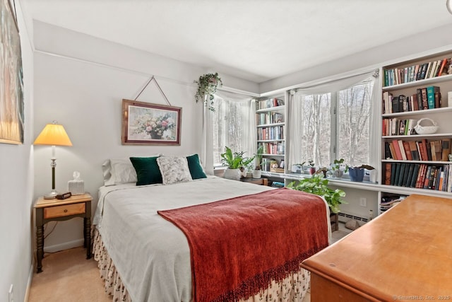 carpeted bedroom with baseboard heating