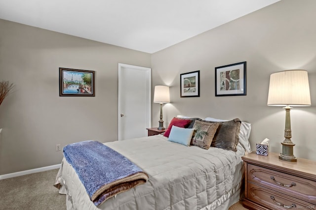 bedroom featuring light carpet