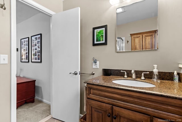 bathroom with vanity and an enclosed shower