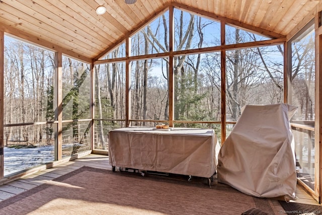 unfurnished sunroom featuring lofted ceiling and wood ceiling