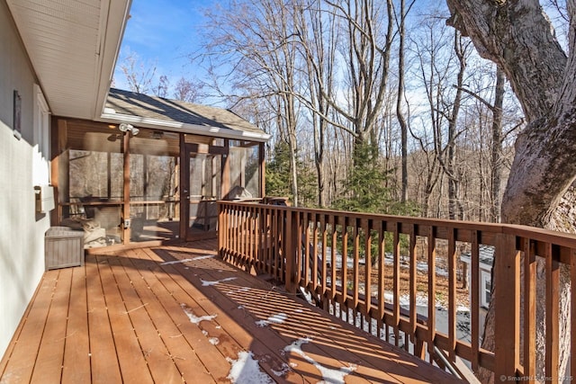 wooden terrace featuring a sunroom