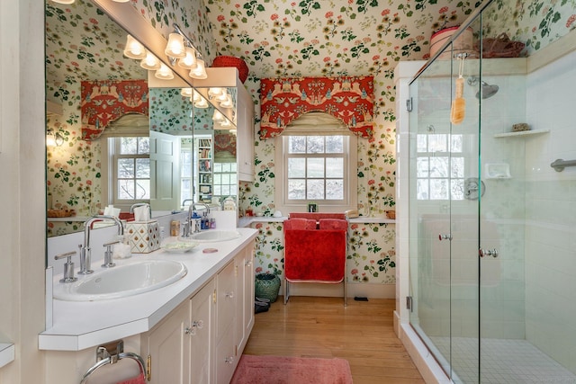 8 Mudgetown Rd, Sharon, CT 06069 - bathroom with wallpapered walls, wood finished floors, double vanity, and a shower stall