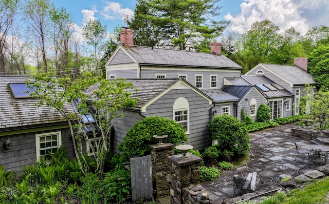 8 Mudgetown Rd, Sharon, CT 06069 - back of property with a patio area and a chimney