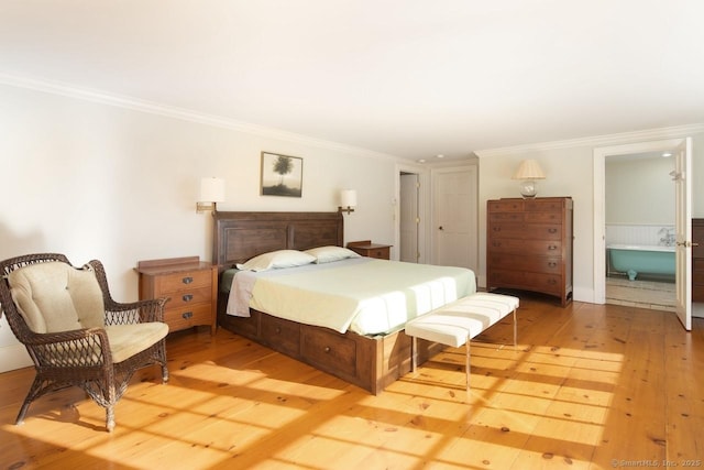 bedroom featuring ornamental molding and light wood-type flooring