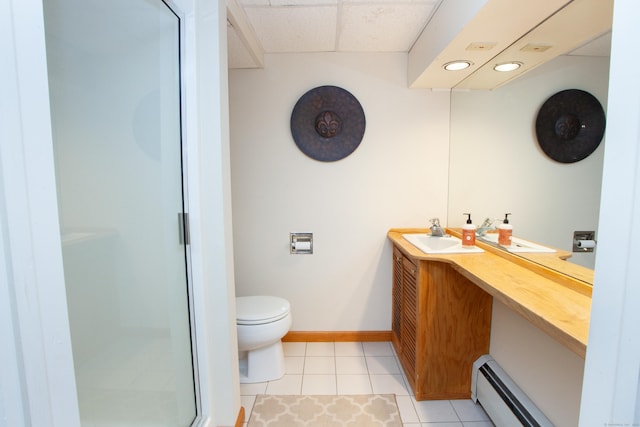 bathroom featuring vanity, baseboard heating, walk in shower, toilet, and tile patterned floors