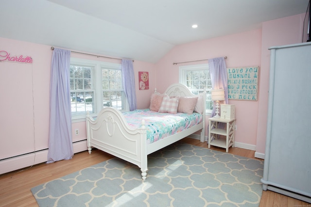 bedroom featuring hardwood / wood-style flooring and vaulted ceiling