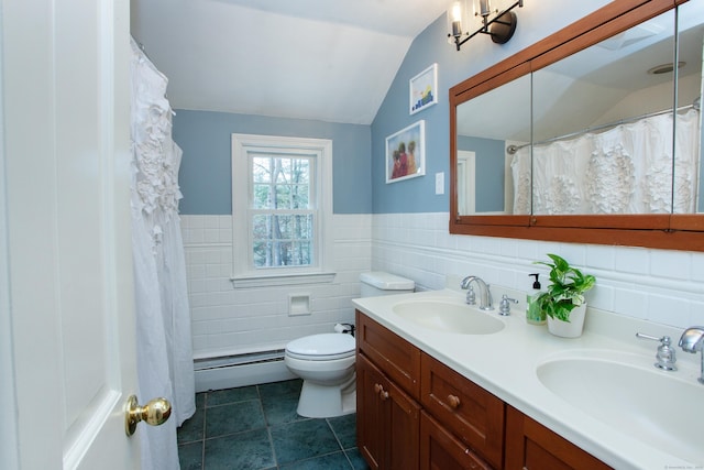 bathroom with lofted ceiling, tile walls, vanity, a baseboard heating unit, and toilet