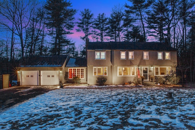 colonial inspired home featuring a garage