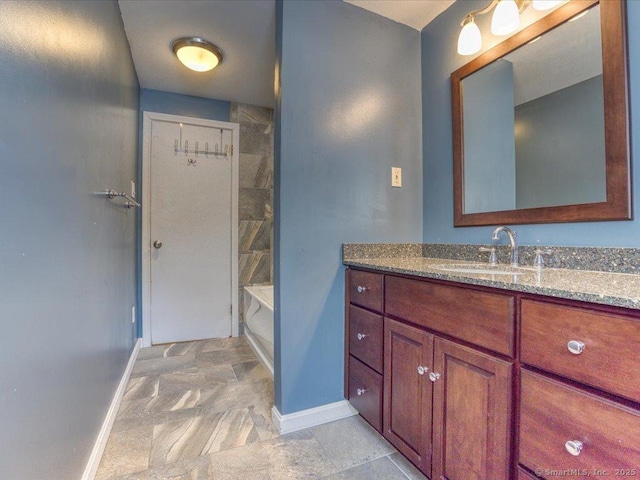 bathroom with vanity and tiled shower / bath