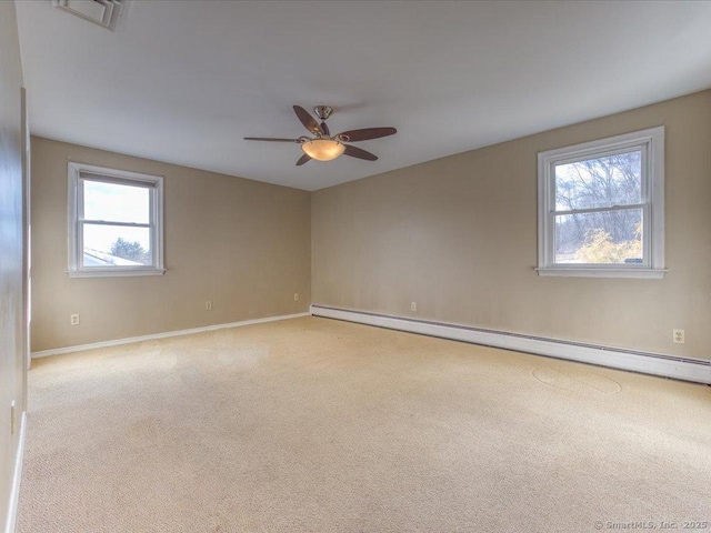 unfurnished room featuring light colored carpet, ceiling fan, and baseboard heating