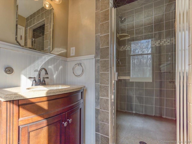 bathroom featuring vanity and an enclosed shower