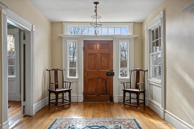 entryway with light hardwood / wood-style floors