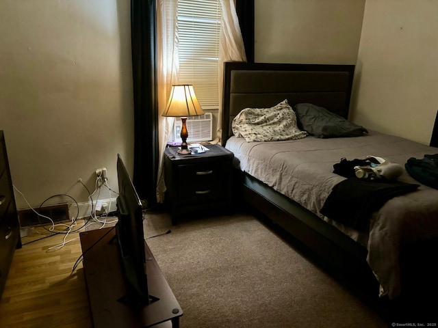 bedroom featuring hardwood / wood-style flooring