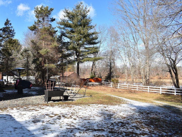 view of yard layered in snow